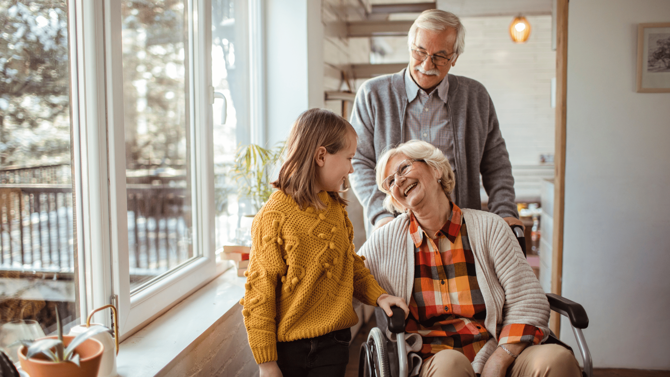 A picture of an elderly couple and their grand daughter. 