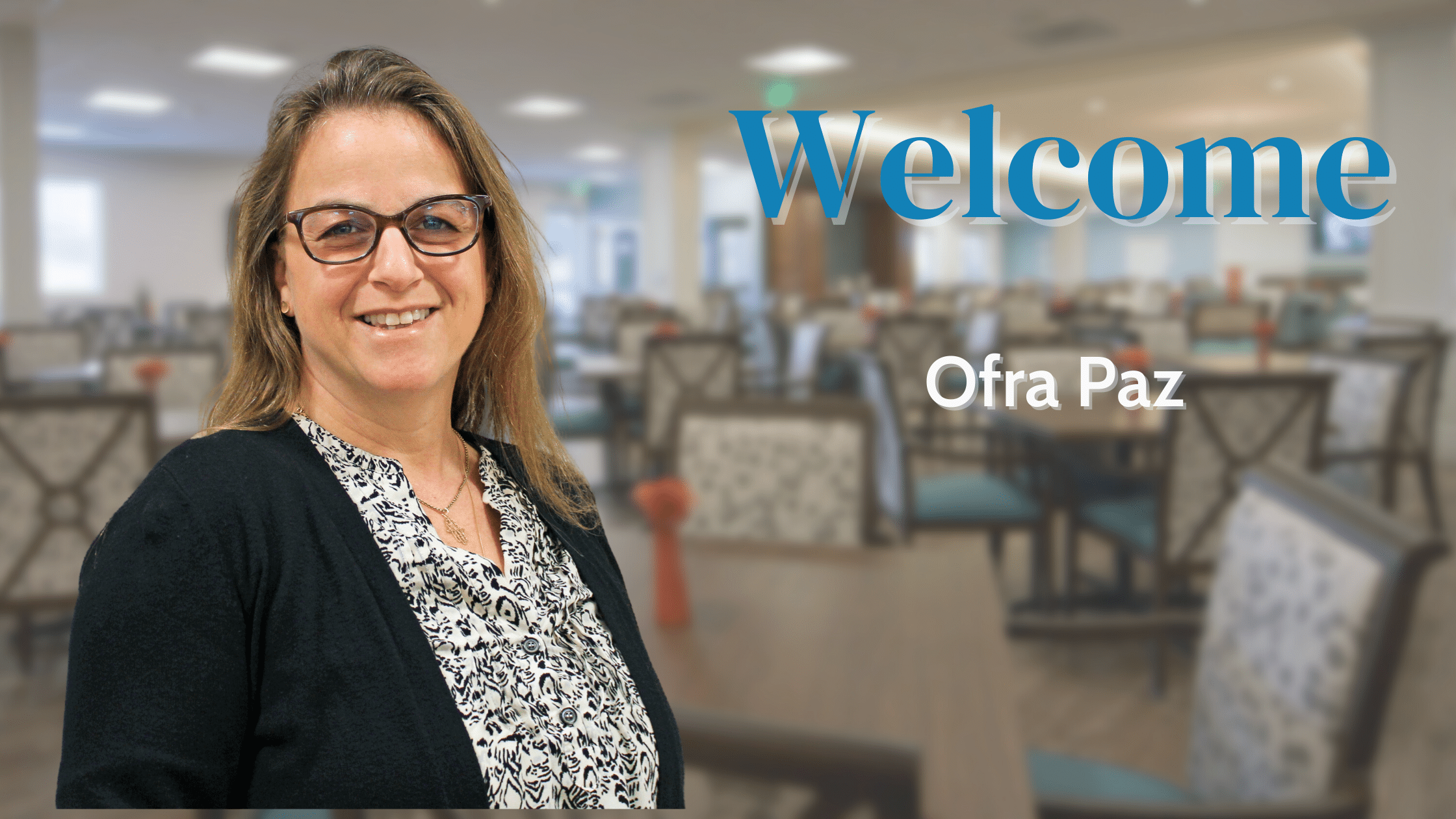 Ofra Paz headshot with word Welcome in blue and Ofra Paz in white in front of a blurred background of the West PACE Center